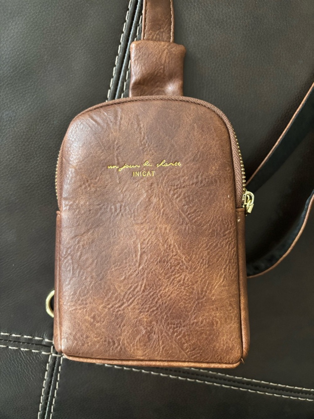 Brown woman’s Leather shoulder Bag.  8” length, 5” width, 2” depth.